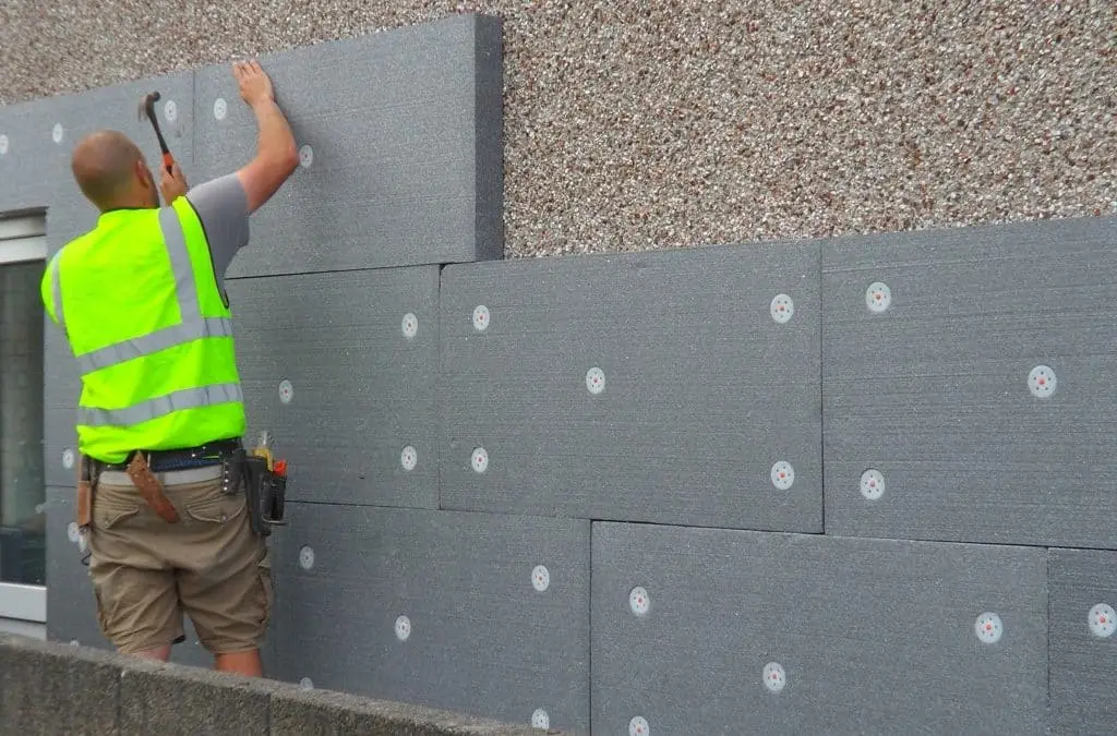 External wall insulation boards being installed on a building